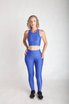 Calça legging fitness feminina cintura alta azul bic em Wonder vista frontal corpo inteiro