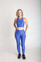 Calça legging fitness feminina cintura alta azul bic em Wonder vista frontal corpo inteiro